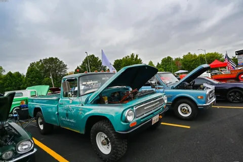 Ram 1500 with soft roll-up tonneau cover and matching fender flares, parked at trailhead
